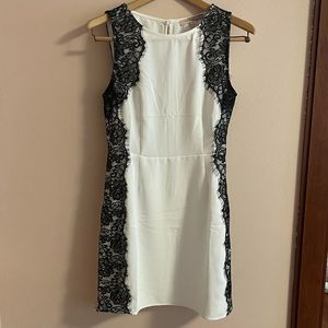 Formal white dress with black lace details
